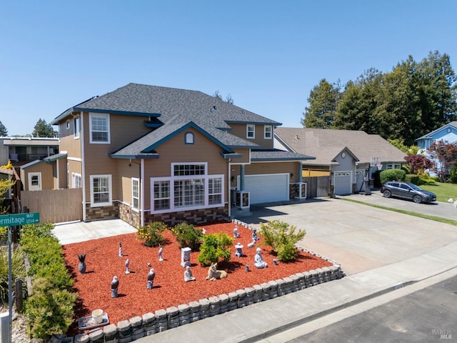 1216 Hermitage Way, Rohnert Park, CA 94928 - traditional-style house with fence, concrete driveway, an attached garage, a shingled roof, and stone siding