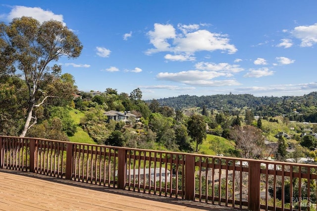 deck featuring a forest view