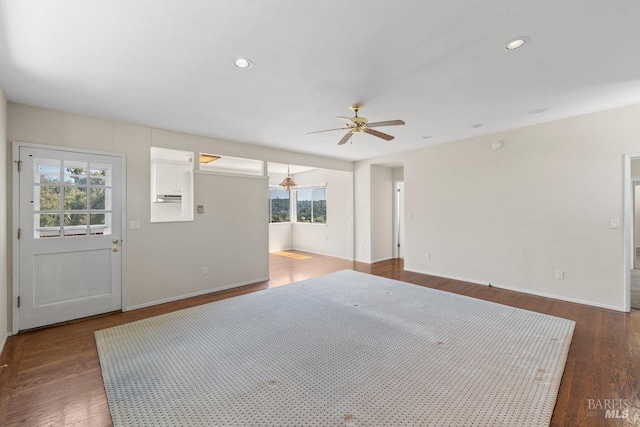 interior space featuring plenty of natural light, baseboards, and ceiling fan
