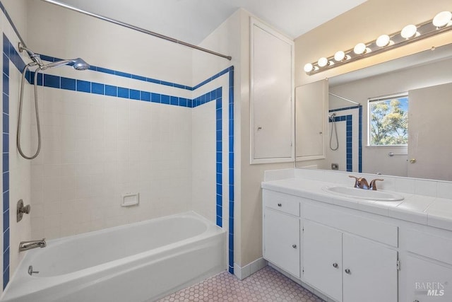 full bath featuring  shower combination, tile patterned flooring, and vanity