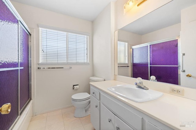 full bath with tile patterned flooring, enclosed tub / shower combo, toilet, and vanity