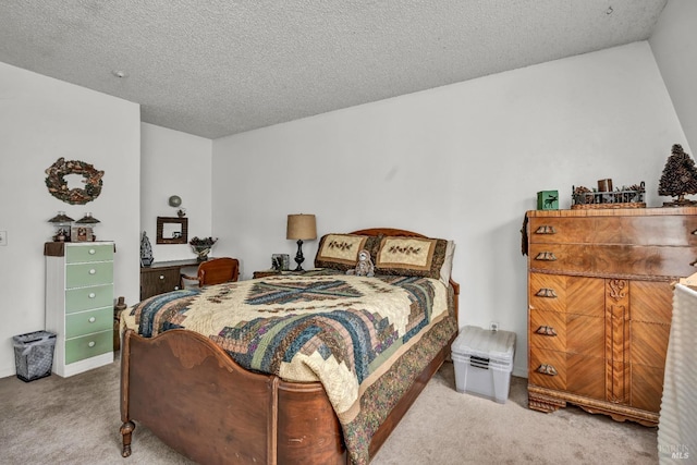 bedroom featuring a textured ceiling and carpet