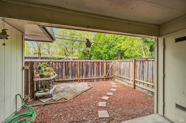 exterior space with a fenced backyard