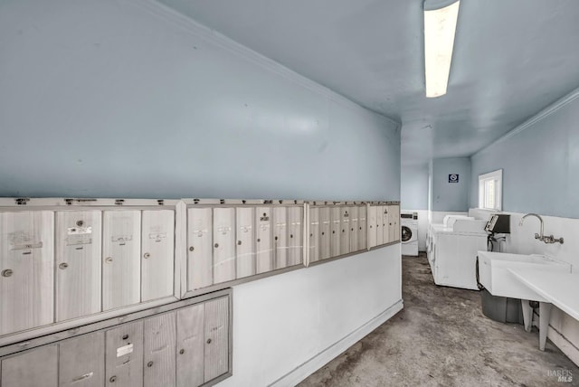 interior space featuring crown molding, separate washer and dryer, and mail area