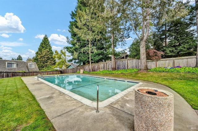view of swimming pool featuring an outdoor fire pit, a fenced backyard, a fenced in pool, a patio area, and a yard
