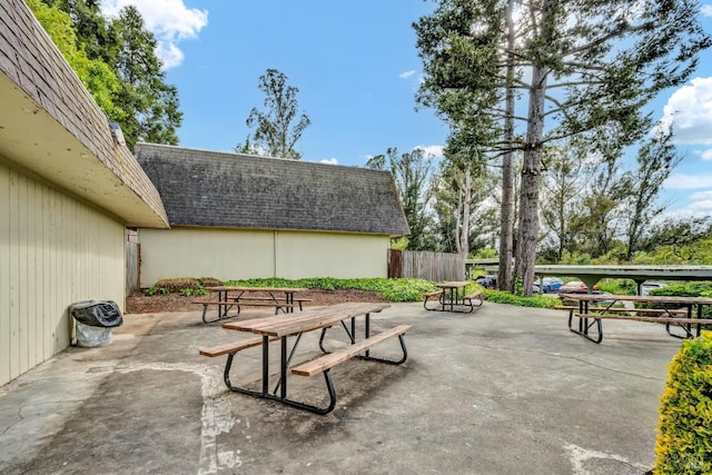 view of patio featuring fence
