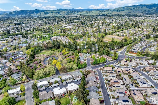 bird's eye view with a residential view and a mountain view