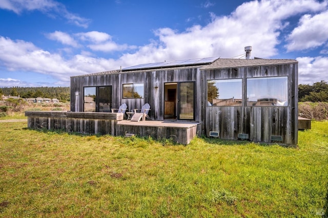 360 Grey Whale, The Sea Ranch, CA 95497 - back of property with a yard and solar panels