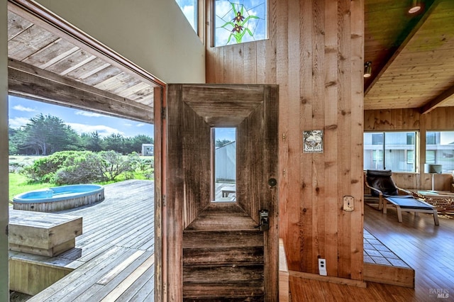360 Grey Whale, The Sea Ranch, CA 95497 - doorway with wood walls, beam ceiling, hardwood / wood-style floors, a high ceiling, and wood ceiling