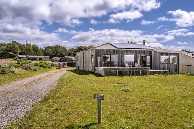 360 Grey Whale, The Sea Ranch, CA 95497 - manufactured / mobile home with fence, solar panels, a front lawn, and gravel driveway