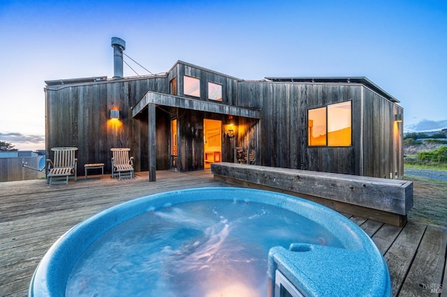 360 Grey Whale, The Sea Ranch, CA 95497 - back of property at dusk with a hot tub and a deck