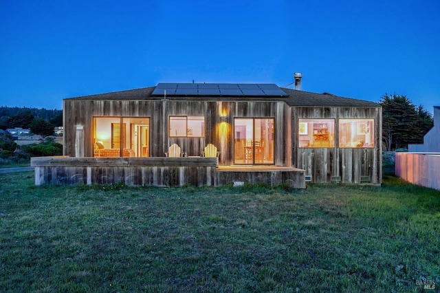 360 Grey Whale, The Sea Ranch, CA 95497 - back of house with a lawn and roof mounted solar panels