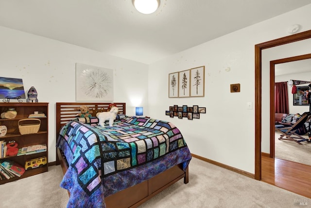 bedroom with baseboards and carpet flooring