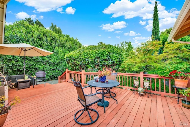 wooden deck featuring an outdoor living space