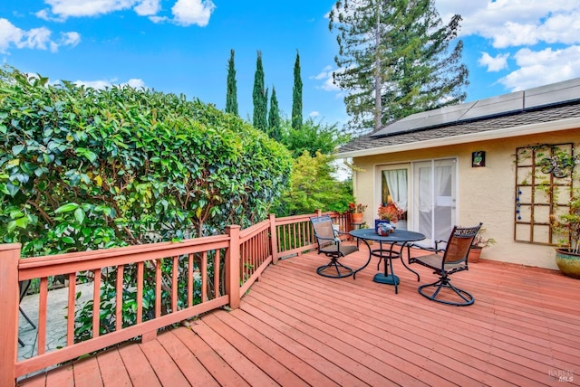 wooden deck featuring outdoor dining space