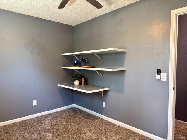 room details with a textured ceiling, ceiling fan, baseboards, and carpet