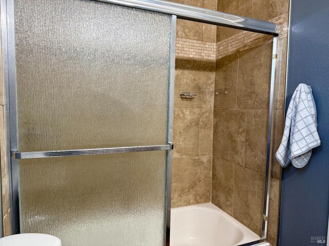 full bath with bath / shower combo with glass door