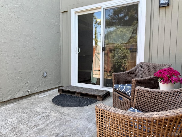 property entrance with a patio