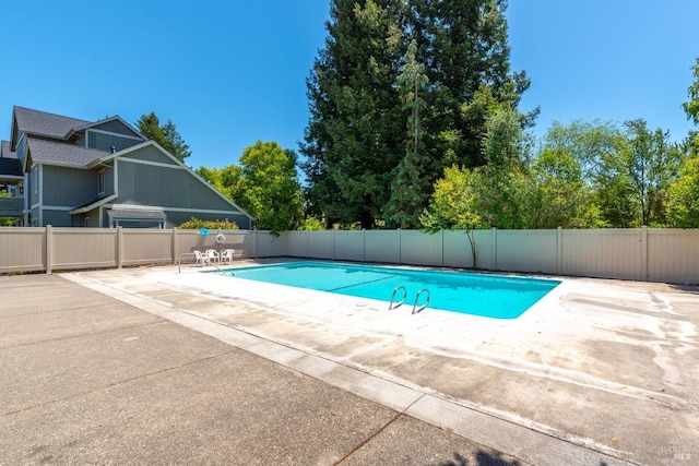 view of pool featuring a patio, fence, and a fenced in pool