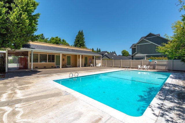 view of pool featuring a patio, fence, and a fenced in pool
