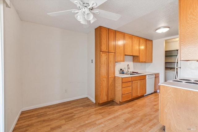 kitchen with a ceiling fan, white dishwasher, light wood-type flooring, light countertops, and a sink