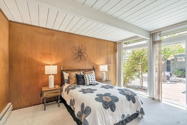 carpeted bedroom with a wall of windows, wood walls, access to exterior, a baseboard radiator, and beamed ceiling