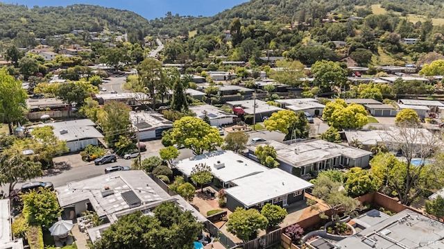 birds eye view of property with a residential view and a wooded view