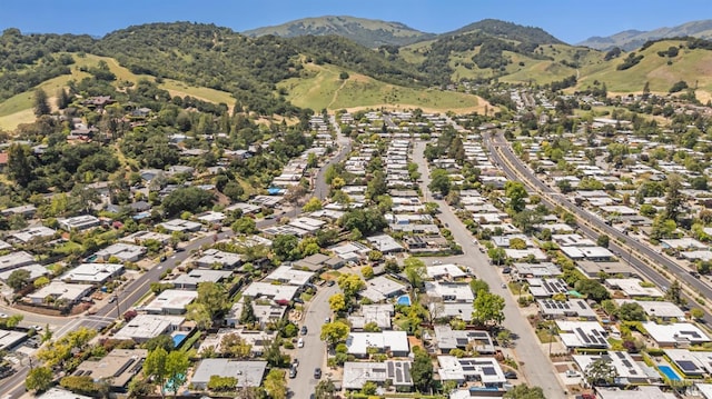 drone / aerial view featuring a residential view and a mountain view