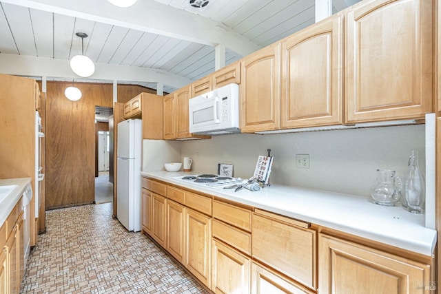 kitchen featuring hanging light fixtures, light countertops, lofted ceiling, light brown cabinets, and white appliances