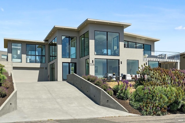 contemporary house featuring a garage and driveway
