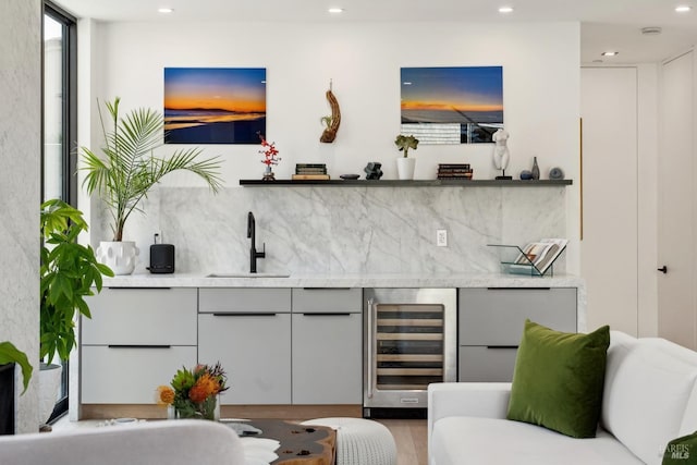 bar with a sink, recessed lighting, wet bar, tasteful backsplash, and wine cooler