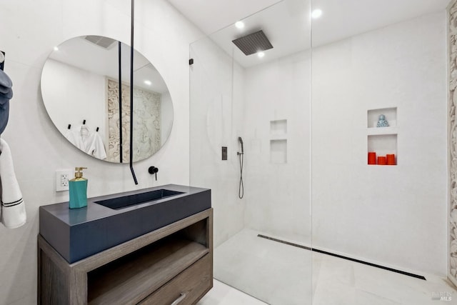 full bathroom featuring built in features, a walk in shower, vanity, and recessed lighting