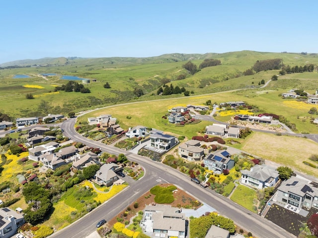birds eye view of property with a water view and a residential view