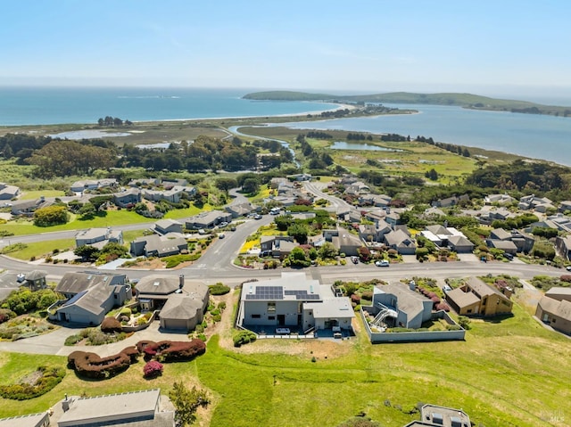 birds eye view of property with a residential view and a water view