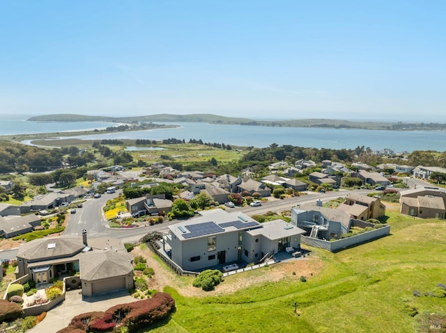 birds eye view of property featuring a water view and a residential view