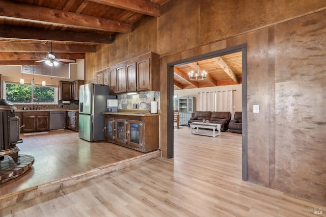 kitchen with stainless steel appliances, light wood finished floors, wood ceiling, beam ceiling, and a chandelier