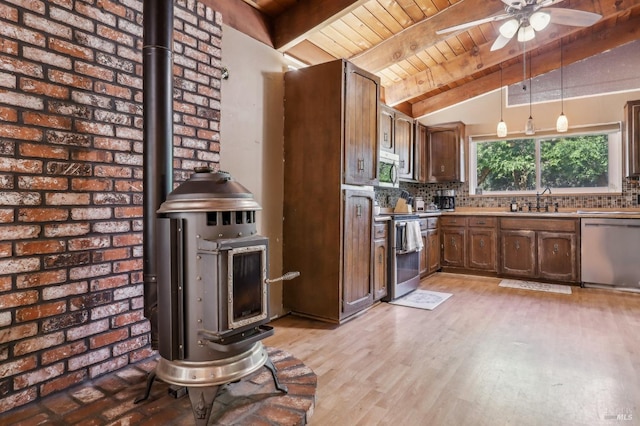 kitchen featuring stainless steel appliances, wooden ceiling, backsplash, ceiling fan, and hanging light fixtures