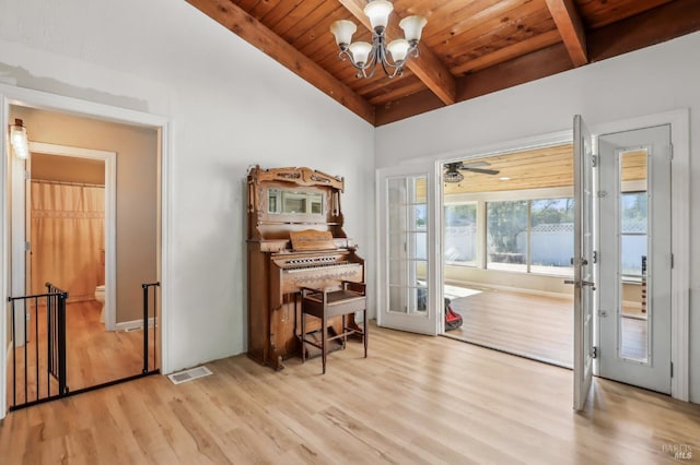 doorway featuring wooden ceiling, french doors, wood finished floors, and a chandelier