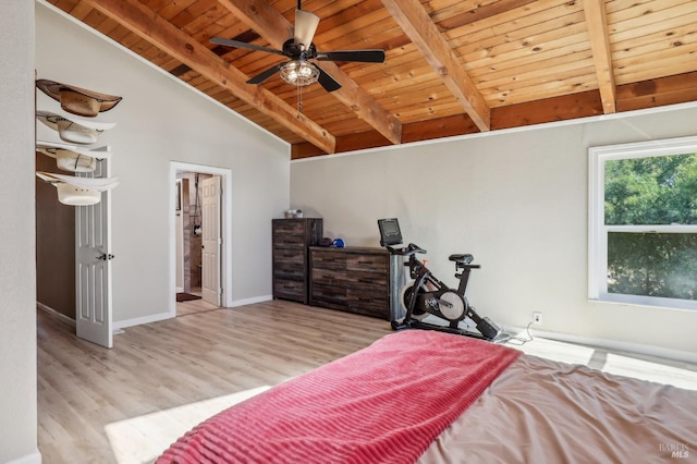 bedroom with wood ceiling, wood finished floors, ensuite bathroom, and baseboards