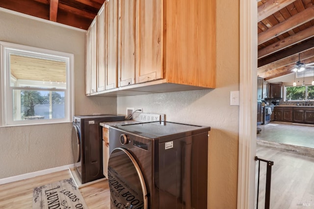 clothes washing area featuring wood ceiling, independent washer and dryer, light wood finished floors, baseboards, and cabinet space