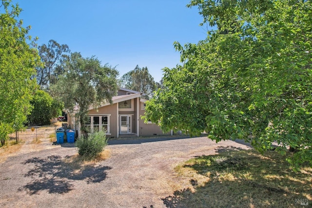 rear view of property with fence
