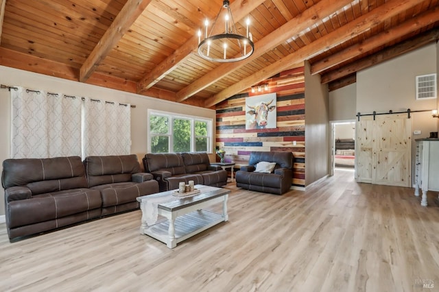 living area with a barn door, wooden ceiling, wood finished floors, beamed ceiling, and a chandelier