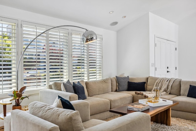 living room with recessed lighting and vaulted ceiling