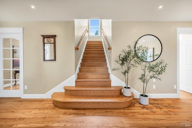 stairs featuring baseboards, recessed lighting, and wood finished floors