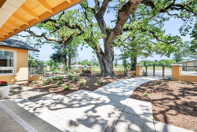 view of patio / terrace featuring fence and a gate