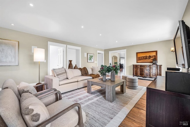 living room with recessed lighting and light wood-style floors