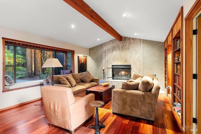 living room featuring a fireplace, wood finished floors, baseboards, lofted ceiling with beams, and recessed lighting