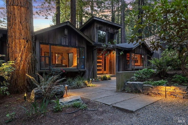 view of back of property at dusk