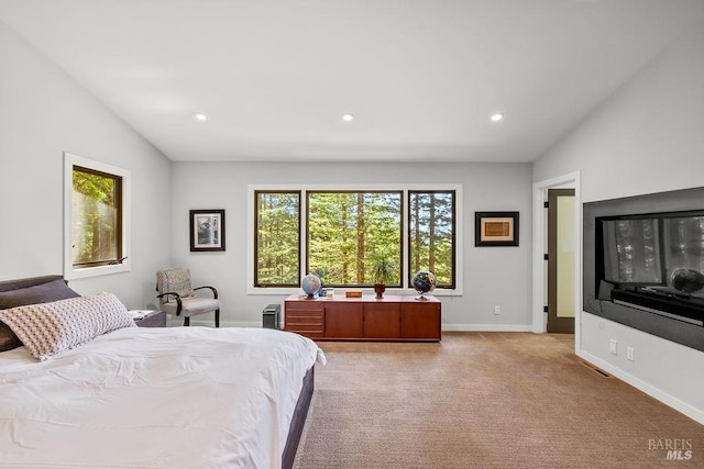 bedroom with recessed lighting, baseboards, light colored carpet, and lofted ceiling