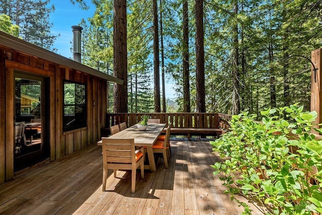 wooden deck with outdoor dining area